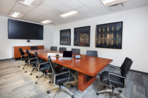 office-conference-room-with-table-chairs-and-tv