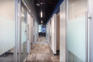 office-hallway-with-carpet-and-glass-doors